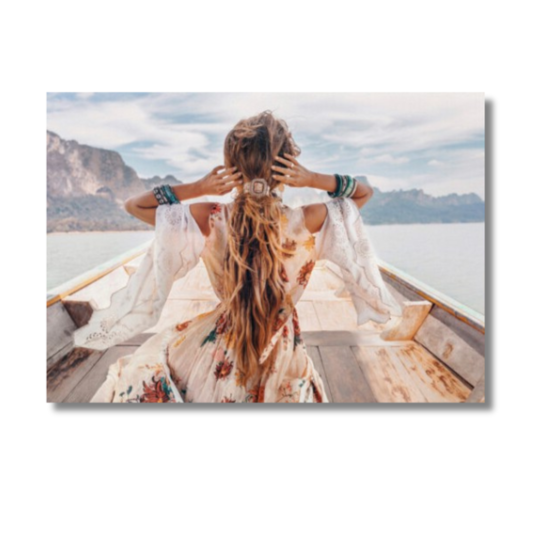 FASHIONABLE YOUNG MODEL IN BOHO STYLE DRESS ON BOAT AT THE LAKE